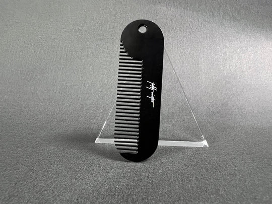 Powder coated hair comb that detangles, is virtually indestructible, and fits perfectly in the palm of your hand.